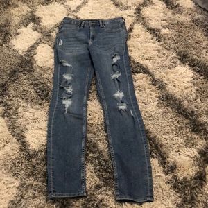 Dark washed blue ripped jeans, size 6